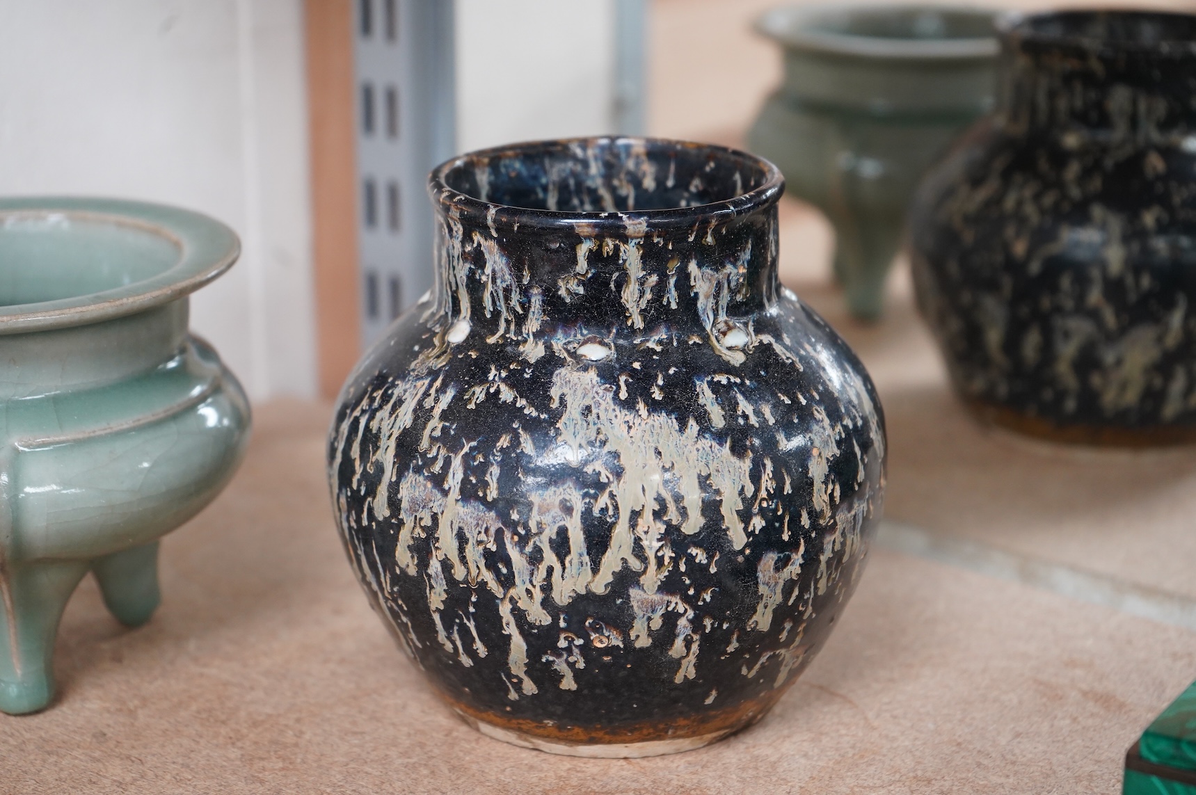 A Chinese celadon tripod censer and vase, largest 14cm high